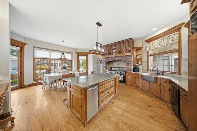 a open kitchen with stainless steel appliances granite countertop a stove and cabinets