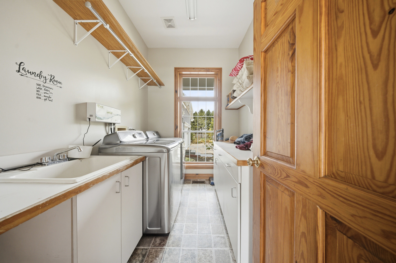 10731 Somonauk Road Hinckley, IL 60520 - Photo 29 of 48 a hallway with sink and mirror