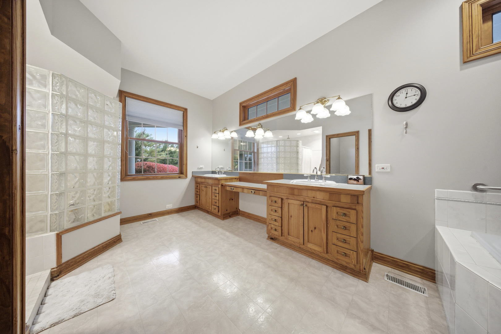 10731 Somonauk Road Hinckley, IL 60520 - Photo 30 of 48 a bathroom with a double vanity sink mirror and bathtub