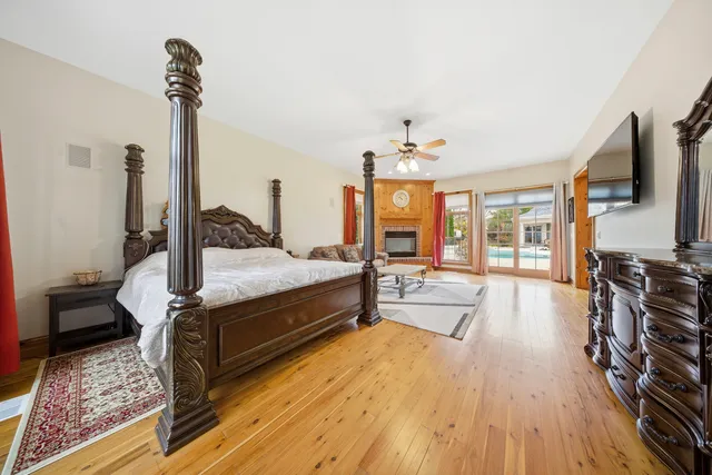a bedroom with furniture and a flat screen tv