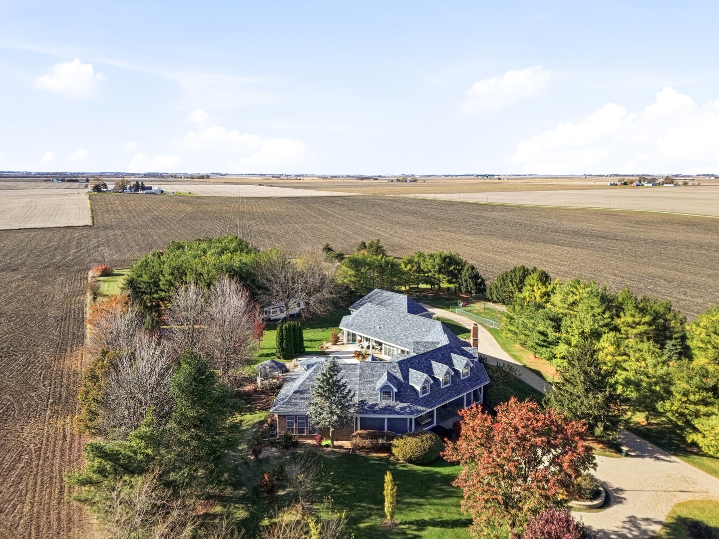 10731 Somonauk Road Hinckley, IL 60520 - Photo 4 of 48 a view of a lake with a mountain in the background