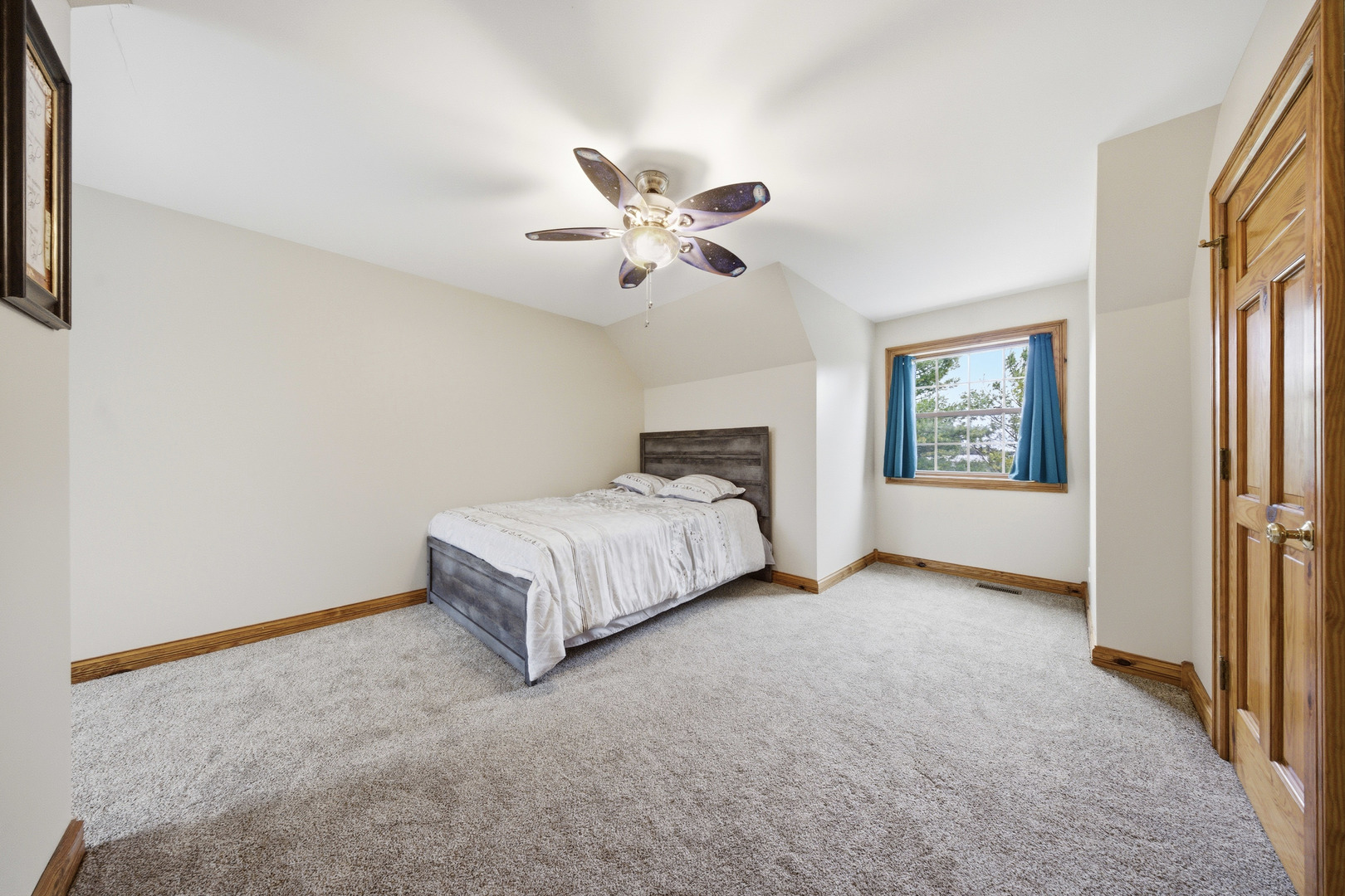 10731 Somonauk Road Hinckley, IL 60520 - Photo 41 of 48 a spacious bedroom with a bed and a chandelier