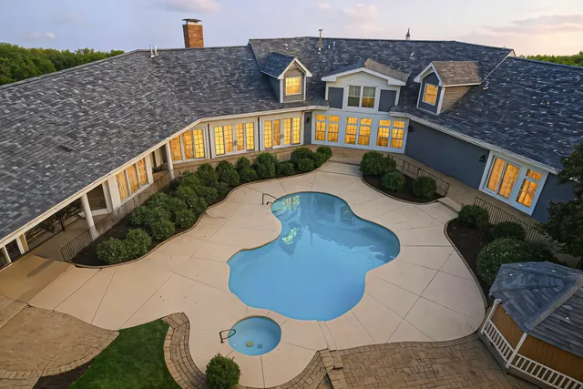 a view of balcony with two chairs and a table