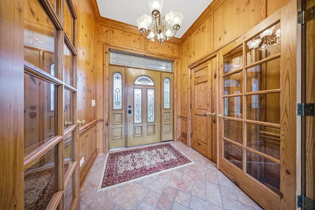 a view of a hallway with a chandelier