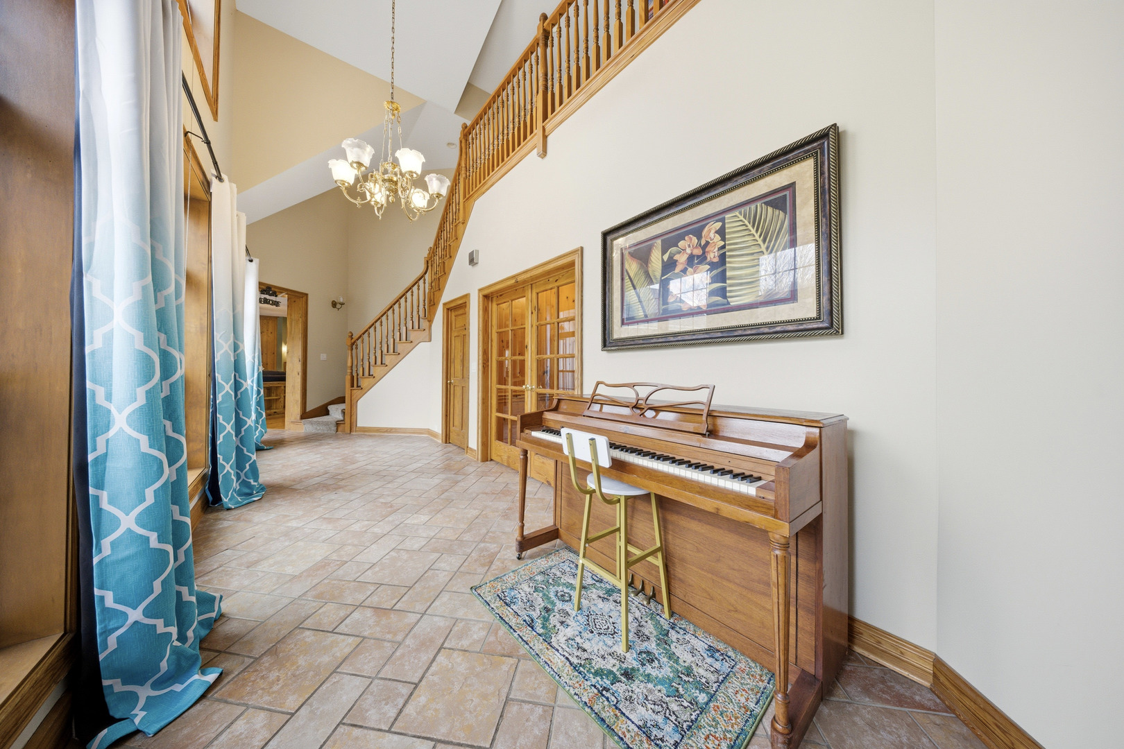 10731 Somonauk Road Hinckley, IL 60520 - Photo 8 of 48 a view of a hallway with furniture and a chandelier