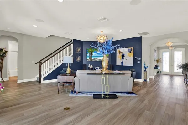 a living room with furniture gym equipment and a view of living room
