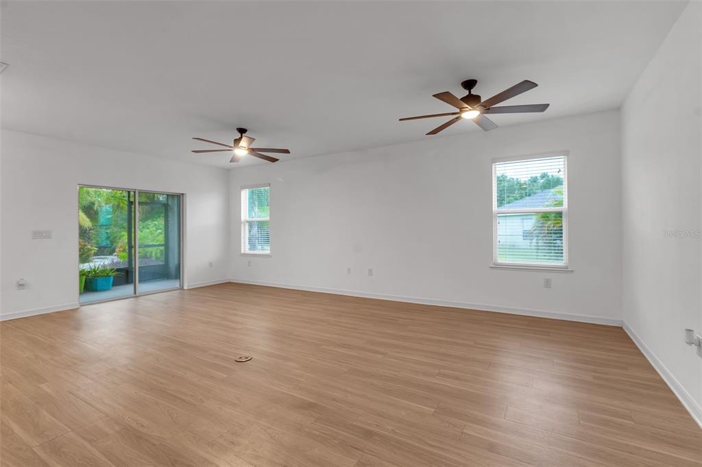 4322 Kiska Road North Port, FL 34288 - Photo 14 of 67 a view of empty room with wooden floor and fan