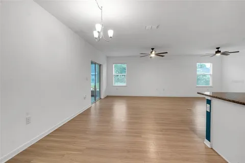 a bathroom with a granite countertop toilet sink and mirror