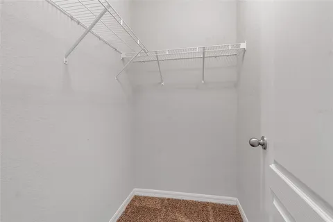 a view of a porch with potted plants and a potted plant