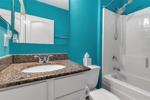 a view of a backyard with sitting area