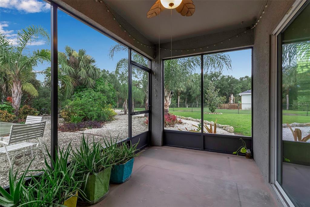 4322 Kiska Road North Port, FL 34288 - Photo 37 of 67 a view of a porch with potted plants and a potted plant