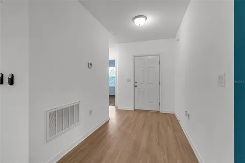 a kitchen with stainless steel appliances granite countertop a stove a microwave and a refrigerator