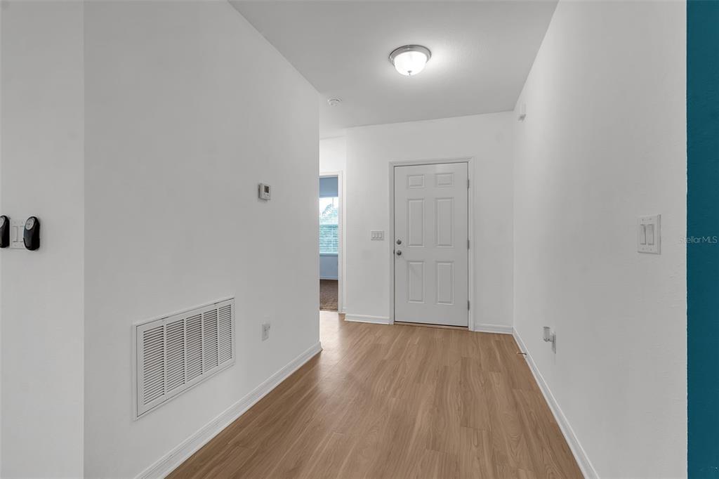 4322 Kiska Road North Port, FL 34288 - Photo 4 of 67 a view of a hallway with wooden floor
