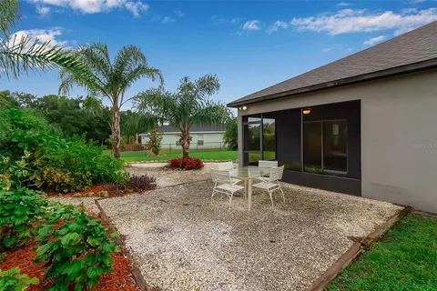 an aerial view of residential houses with outdoor space and street view