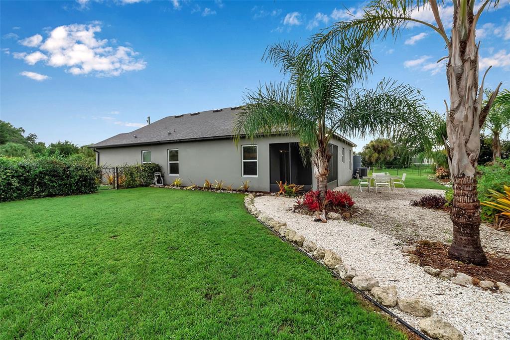 4322 Kiska Road North Port, FL 34288 - Photo 44 of 67 a view of a house with backyard and a tree