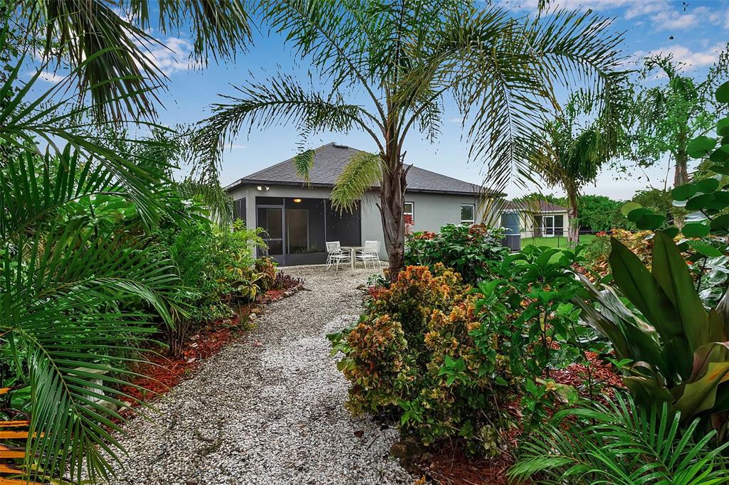 4322 Kiska Road North Port, FL 34288 - Photo 46 of 67 a front view of house with yard and green space