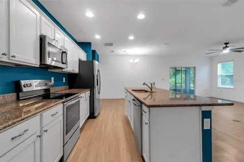 a view of kitchen island wooden floor