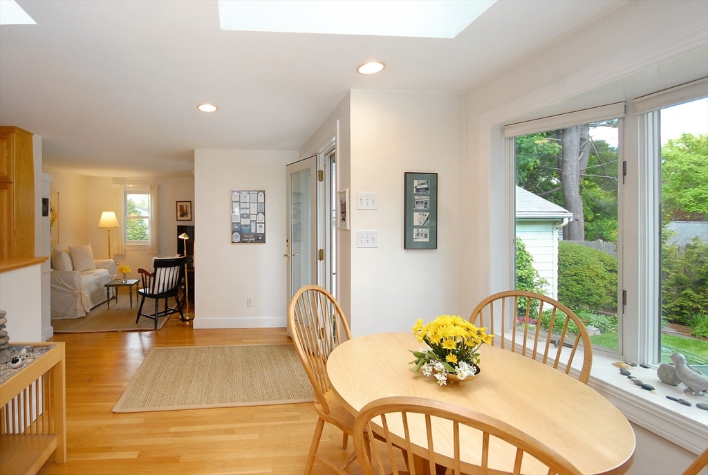 51 MacArthur Road Concord, MA 01742 - Photo 11 of 42 a view of a dining room with furniture window and wooden floor