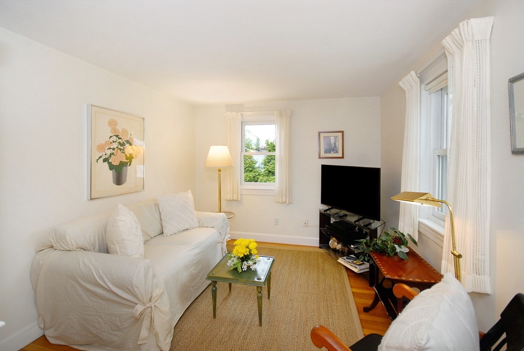 51 MacArthur Road Concord, MA 01742 - Photo 12 of 42 a living room with furniture and a flat screen tv