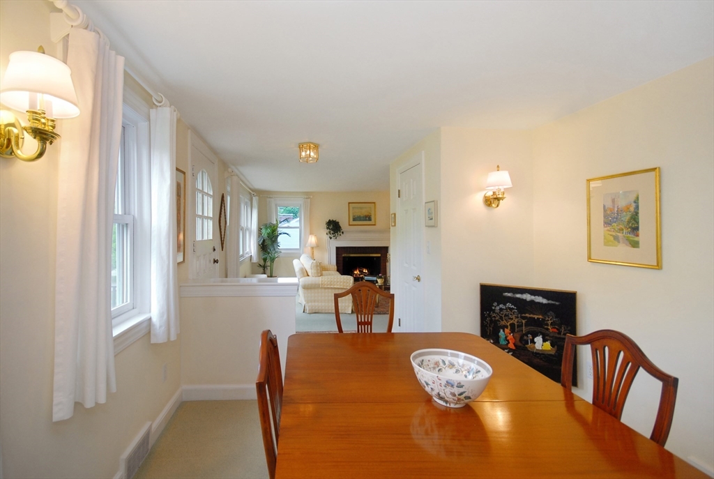 51 MacArthur Road Concord, MA 01742 - Photo 13 of 42 a living room with furniture and a fireplace