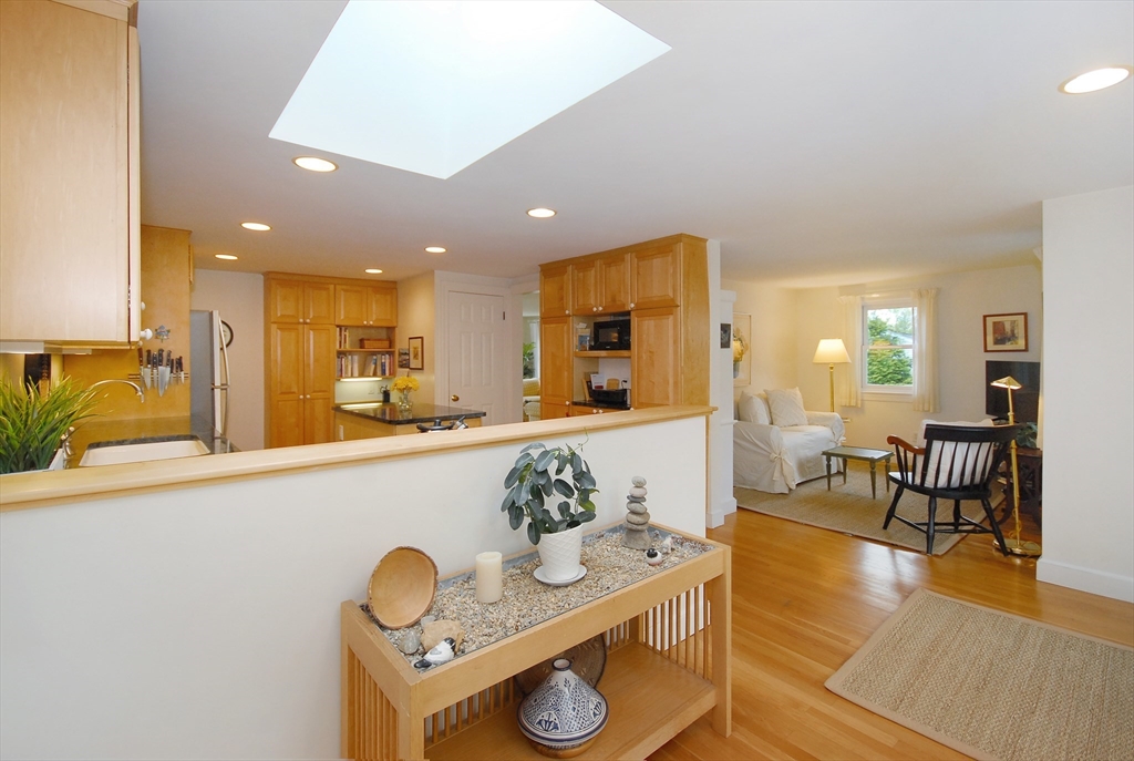 51 MacArthur Road Concord, MA 01742 - Photo 17 of 42 a kitchen with stainless steel appliances granite countertop a sink and a wooden cabinets