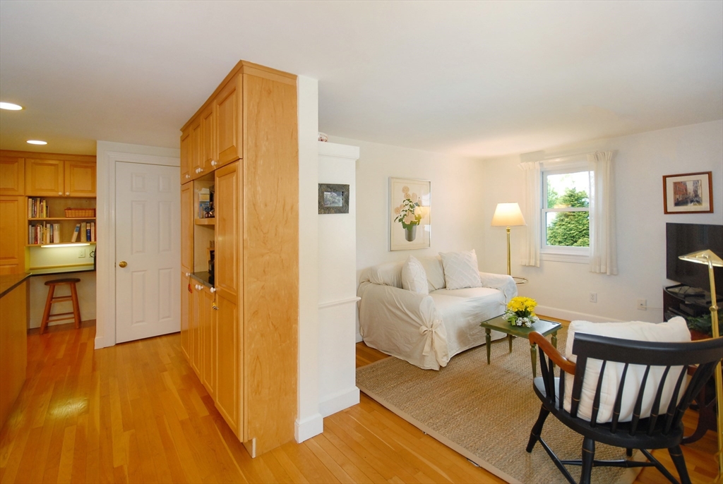 51 MacArthur Road Concord, MA 01742 - Photo 19 of 42 a living room with furniture and a wooden floor