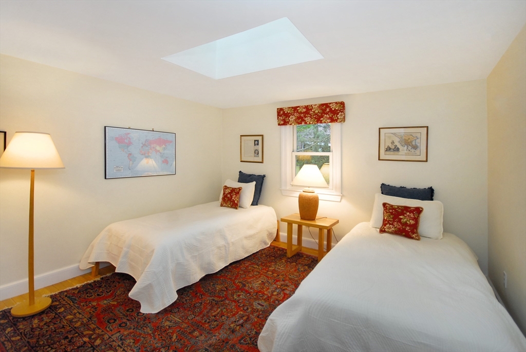 51 MacArthur Road Concord, MA 01742 - Photo 26 of 42 a bedroom with two beds and painting on the wall