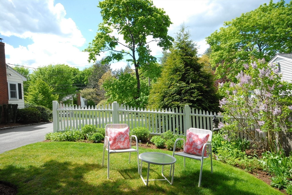 51 MacArthur Road Concord, MA 01742 - Photo 34 of 42 a view of a chair and table in the garden