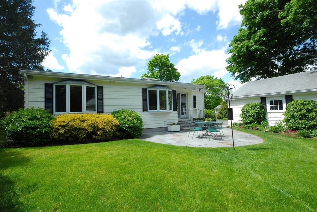 51 MacArthur Road Concord, MA 01742 - Photo 35 of 42 a view of a house with backyard and sitting area