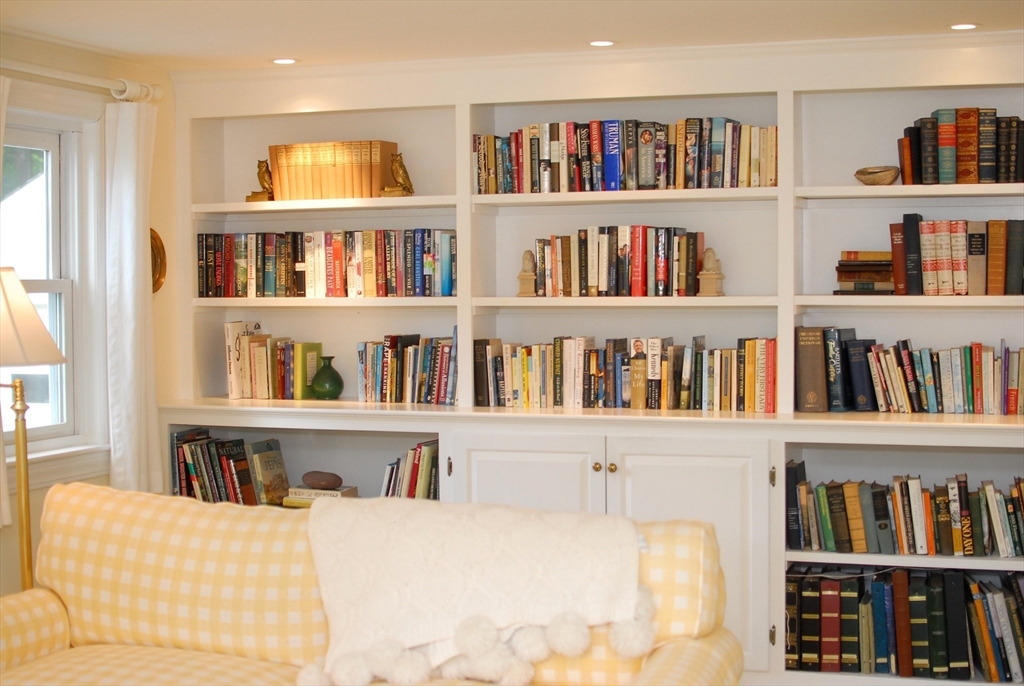 51 MacArthur Road Concord, MA 01742 - Photo 41 of 42 a living room with lots of books
