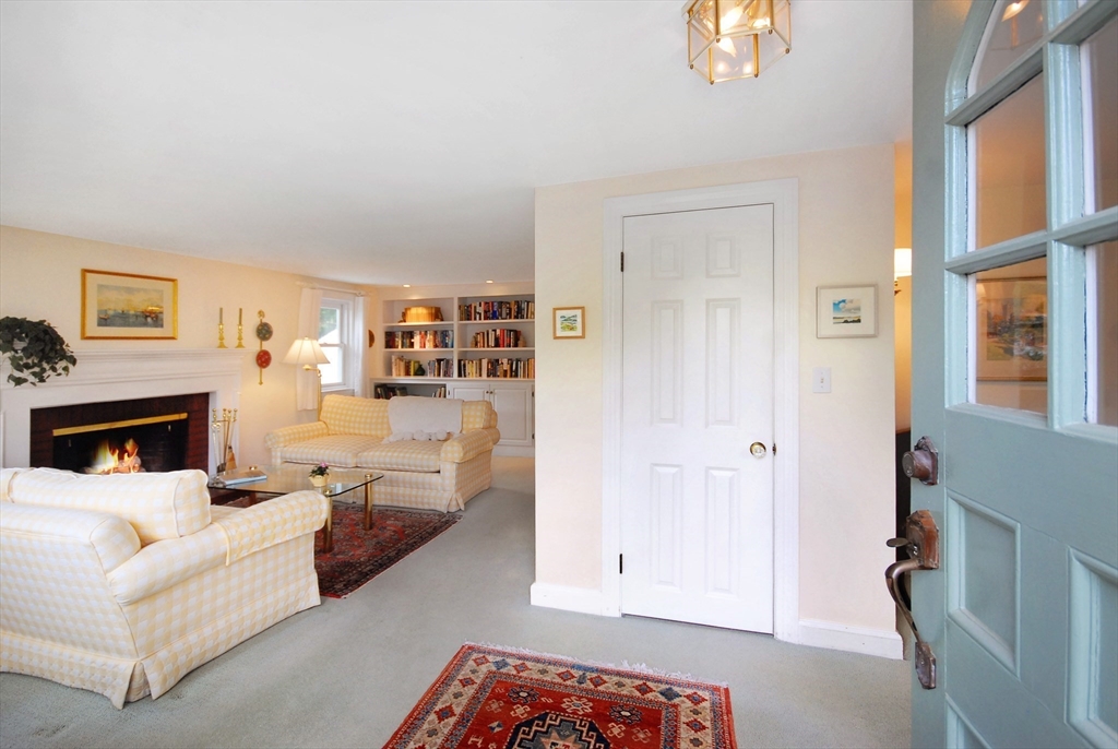 51 MacArthur Road Concord, MA 01742 - Photo 7 of 42 a living room with furniture and a fireplace