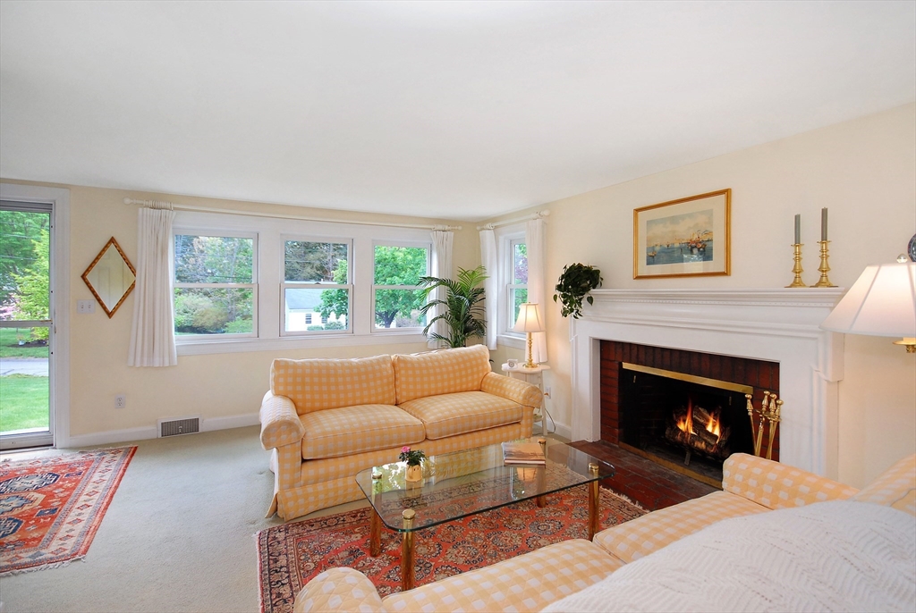 51 MacArthur Road Concord, MA 01742 - Photo 8 of 42 a living room with furniture and a fireplace