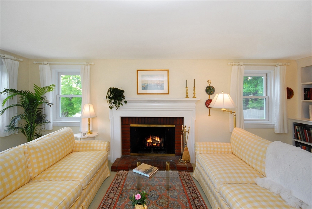51 MacArthur Road Concord, MA 01742 - Photo 9 of 42 a living room with furniture and a fireplace