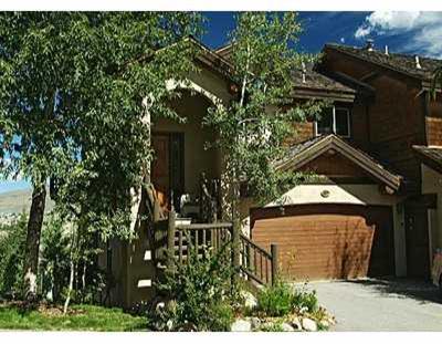 137 Knudson Ranch Road, Unit 137 Edwards, CO 81632 - Photo 1 of 8 a view of a house with a tree