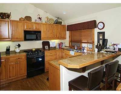 137 Knudson Ranch Road, Unit 137 Edwards, CO 81632 - Photo 5 of 8 a kitchen with a sink cabinets and appliances