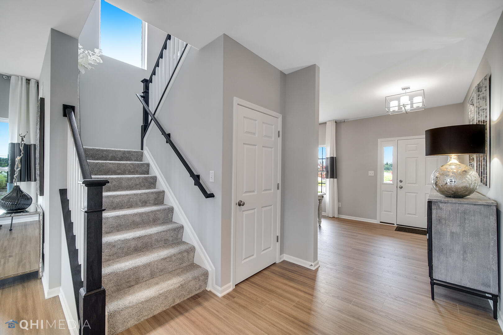 25 Levanno Drive Crown Point, IN 46307 - Photo 4 of 25 a view of a hallway with wooden floor and staircase