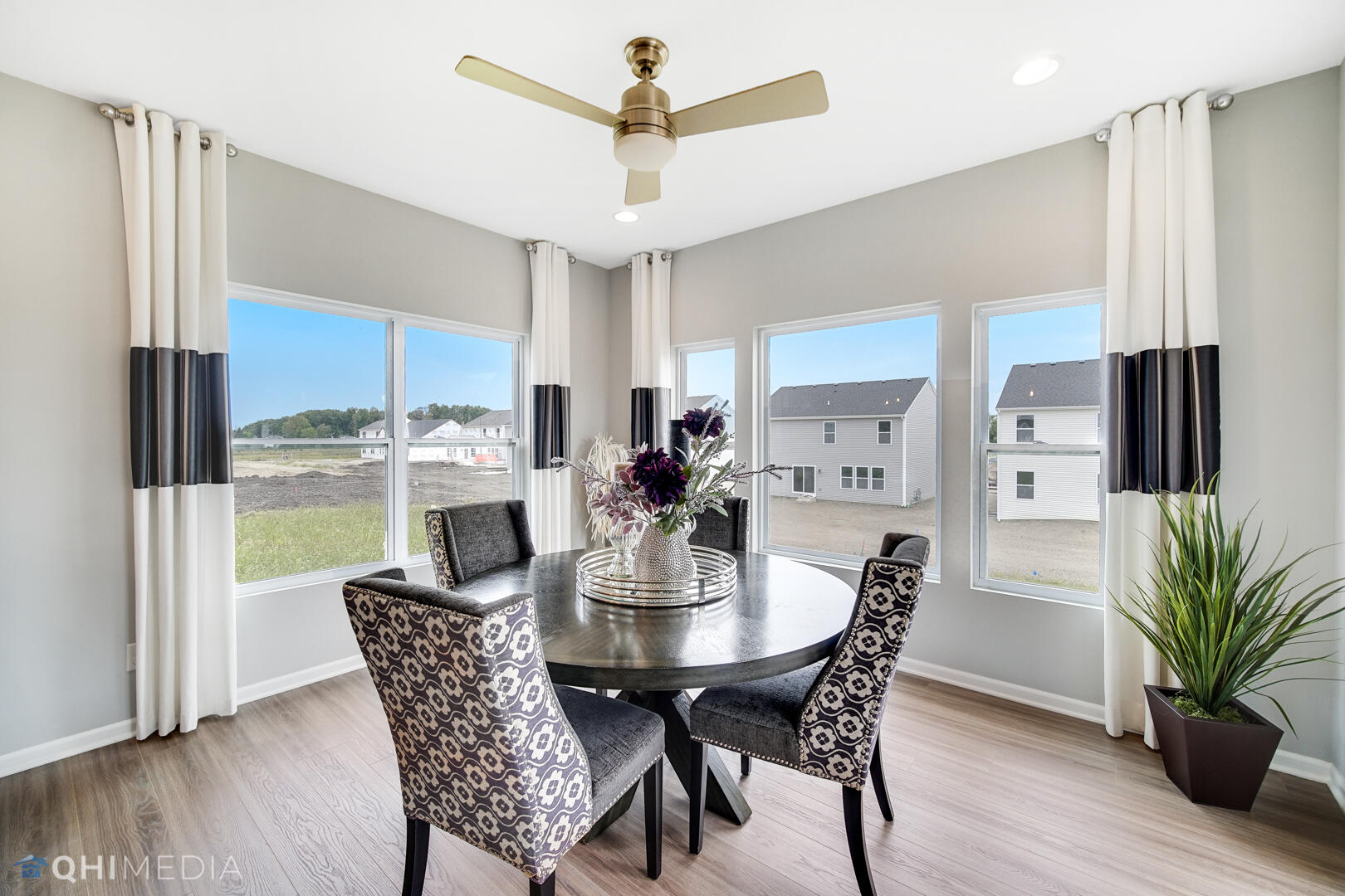 25 Levanno Drive Crown Point, IN 46307 - Photo 9 of 25 a view of a dining room with furniture window and wooden floor
