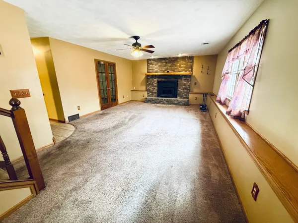 a view of livingroom with furniture and a flat screen tv