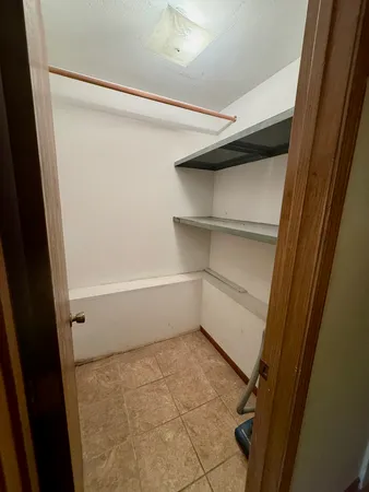 a empty closet with white paint