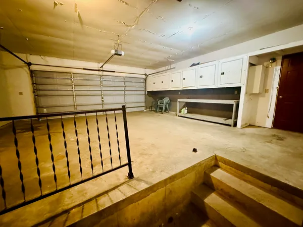 a view of a hardwood floor and staircase