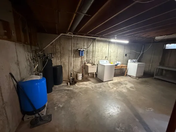 a storage and utility room with furniture