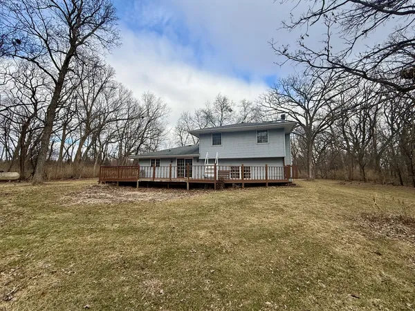 a house that has a tree in front of it
