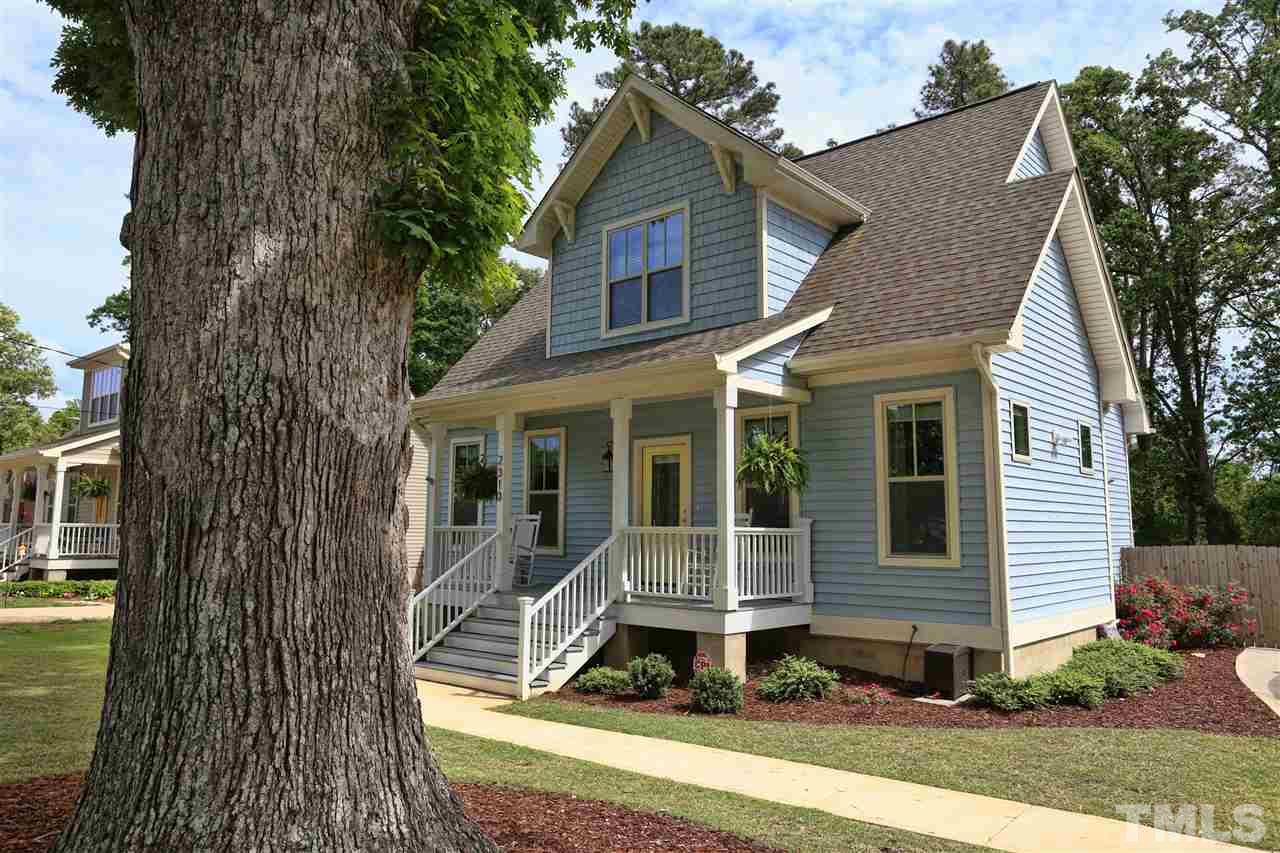 2310 Milburnie Road Raleigh, NC 27610 - Photo 2 of 25 a front view of a house with a yard