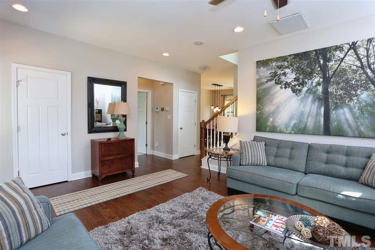 2310 Milburnie Road Raleigh, NC 27610 - Photo 12 of 25 a living room with furniture and a rug