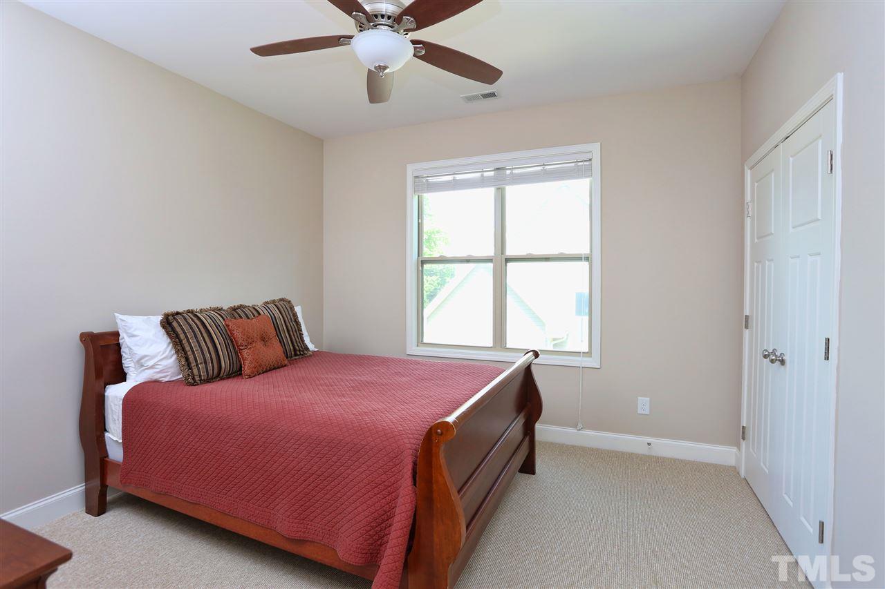 2310 Milburnie Road Raleigh, NC 27610 - Photo 16 of 25 a bedroom with a bed and window