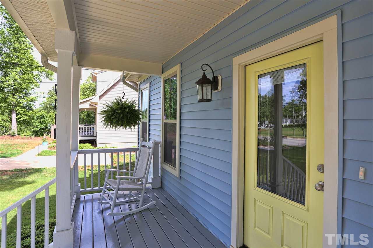 2310 Milburnie Road Raleigh, NC 27610 - Photo 3 of 25 a view of a porch with wooden floor and outdoor seating