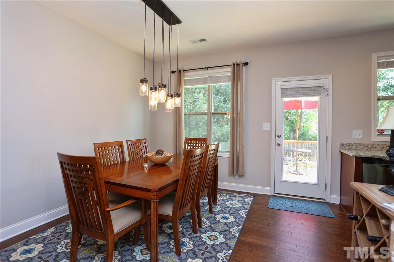 2310 Milburnie Road Raleigh, NC 27610 - Photo 7 of 25 a dining room with furniture window wooden floor