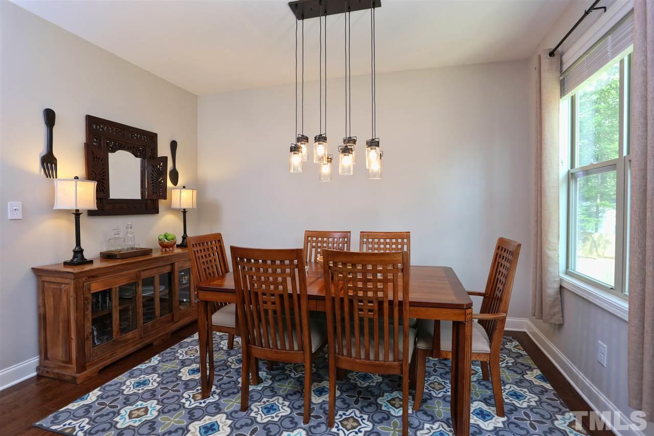2310 Milburnie Road Raleigh, NC 27610 - Photo 8 of 25 a view of a dining room with furniture window and wooden floor