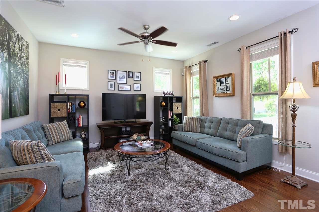 2310 Milburnie Road Raleigh, NC 27610 - Photo 9 of 25 a living room with furniture and a flat screen tv
