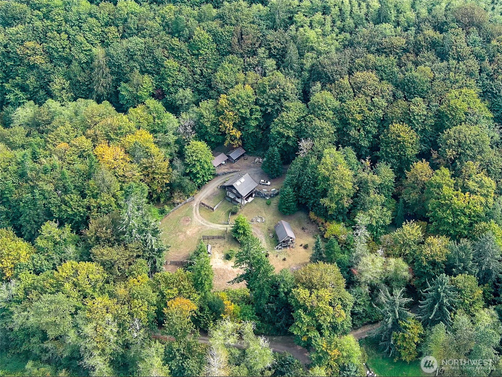 106 Crocker Lake Road Quilcene, WA 98376 - Photo 17 of 34 an aerial view of residential house with outdoor space and trees all around